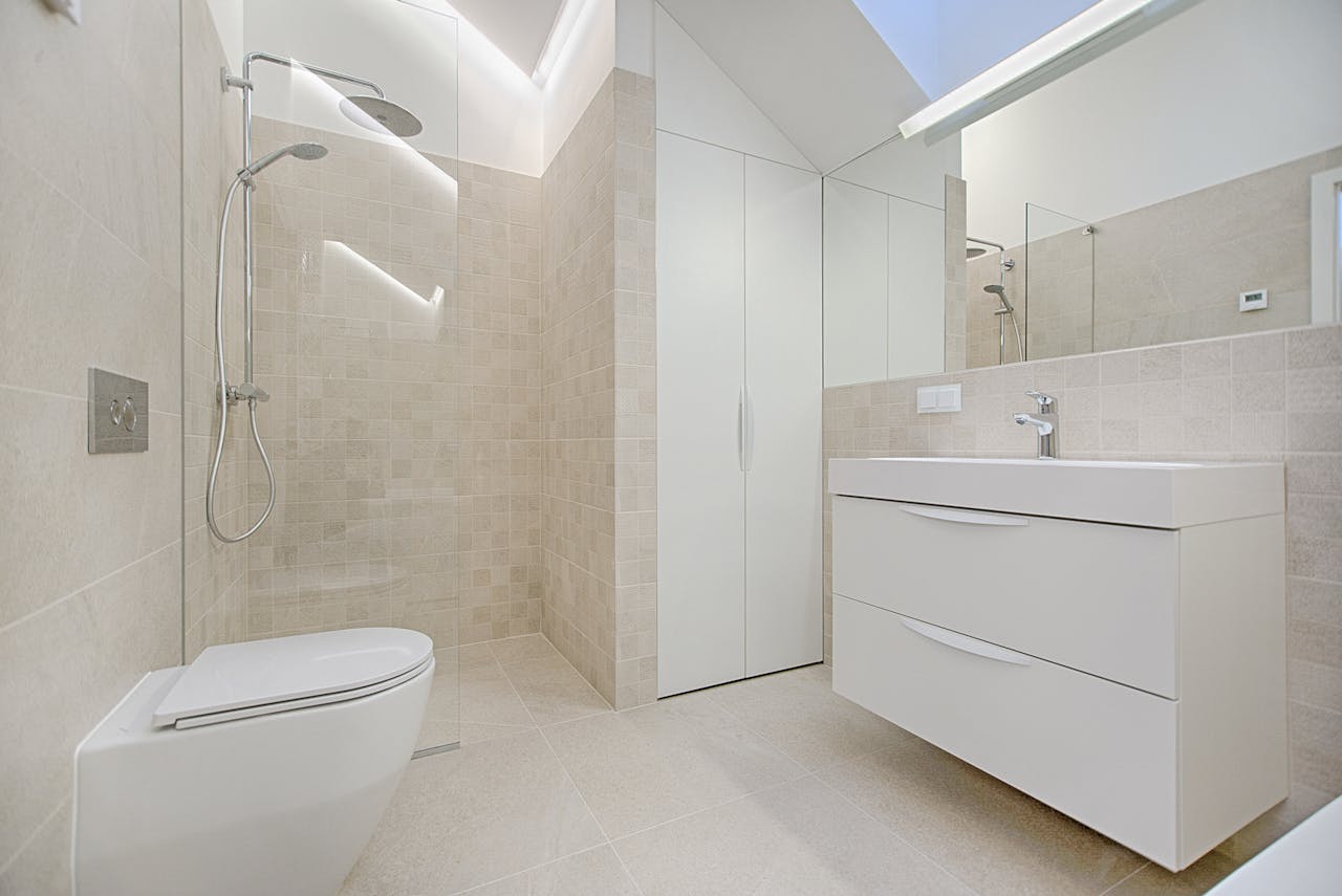 our-services-3 Bright and luxurious bathroom with contemporary fixtures and sleek design.